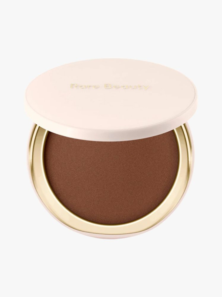 Rare Beauty Warm Wishes Soft Matte Powder Bronzer in branded component on a light gray background